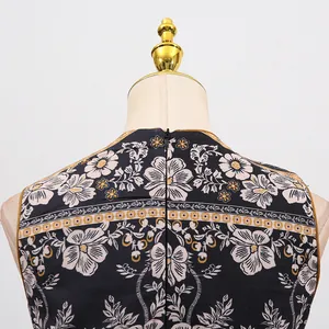 Detail view of a vintage floral print dress showing the back neckline and zipper closure.