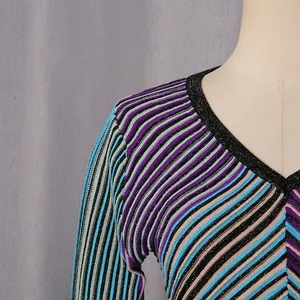 Detailed close-up showing the V-neckline and colorful striped texture of a knit dress