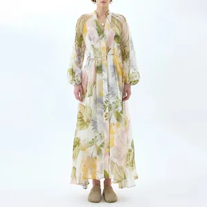 Detail showing the elegant floral print and puff sleeves of this V-neck maxi dress.