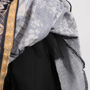 Detailed macro view of the hem and floral pattern of a vintage French style dress