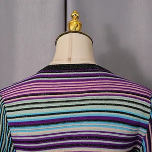Detailed close-up of the neckline and fabric texture on a colorful striped knit dress.