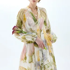 Detailed view of long-sleeved floral maxi dress with elegant V-neck and puffed sleeves.