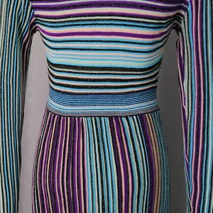 Macro detail of colorful striped knit dress showing fine texture and slim high waistline
