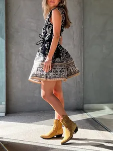 Elegant vintage French floral print sleeveless dress featuring waist tie details