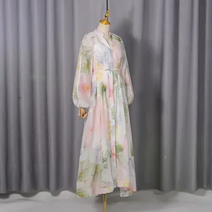 Detailed view of the floral print maxi dress featuring puff sleeves and V-neckline