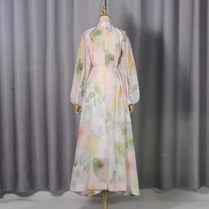 Back view of elegant floral print maxi dress featuring sweet puff sleeves and a long skirt