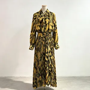 Elegant women's two-piece set with yellow brushstroke print and pleated maxi skirt