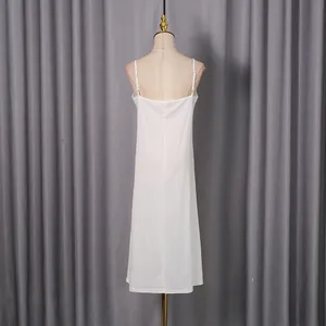 Detailed back view of an elegant white camisole midi slip dress shown on a mannequin