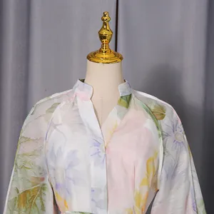 Detail view of floral print dress featuring elegant V-neck and soft puff sleeves design