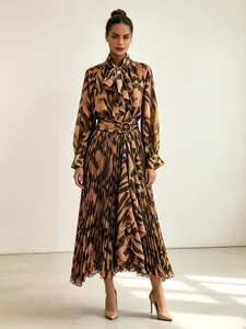 Elegant animal print two-piece set with tie-neck long sleeve shirt and pleated maxi skirt