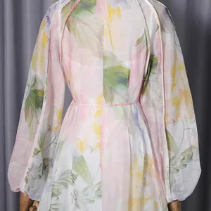 Detailed view of the delicate floral watercolor pattern on this elegant maxi dress.