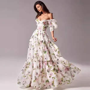 Romantic off-the-shoulder floral gown with corset bodice and flowing tiered skirt