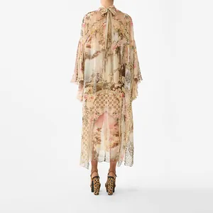 Detailed back view of an elegant French palace style print maxi dress with tie neck design.