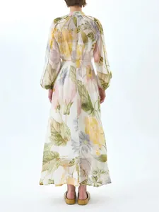 Elegant floral print maxi dress with long puff sleeves and flowy hem in sweet style