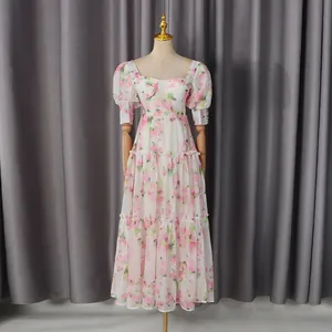 Romantic retro floral dress with sweetheart neckline and tiered midi skirt detail.