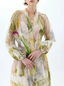 Elegant floral print maxi dress with V-neck and puff sleeves for a sweet summer look