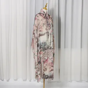 Front view of French court style printed long dress featuring elegant high neck and bow tie