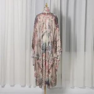 Back view of a French palace style long dress with floral and leopard print on a mannequin.