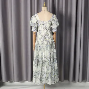 Back view of a romantic vintage floral dress with corset lacing and tiered skirt