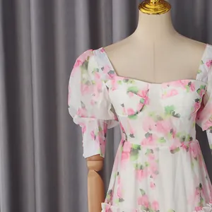 Close-up of a romantic vintage floral dress with puff sleeves and corset bodice