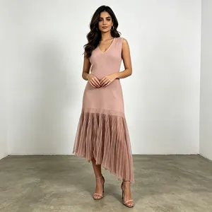 Full view of sleeveless V-neck pink dress with asymmetrical pleated mesh hem design.