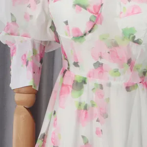 Close-up of romantic floral dress featuring sweetheart neckline and corset bodice