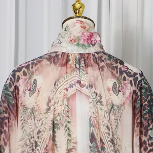 Detailed close-up of high-neck French court style dress with floral and leopard print