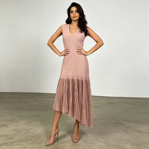 Detail view of elegant sleeveless V-neck dress with irregular pleated mesh hem style.