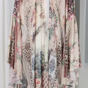 Close-up of French style floral and leopard print maxi dress with ruffle details.