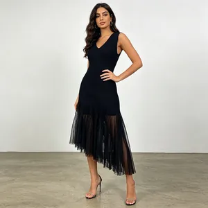 Elegant black sleeveless V-neck dress featuring an asymmetrical sheer mesh hemline detail