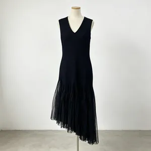 Elegant black sleeveless V-neck dress with irregular mesh hem and pleated bodice detail.