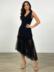 Elegant sleeveless V-neck black dress with irregular mesh hem and sexy feminine design
