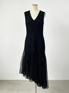 Elegant black sleeveless V-neck dress featuring an asymmetrical pleated mesh hem design