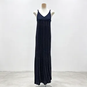 Front view of sleeveless navy pleated dress with white vertical pinstripes on mannequin.