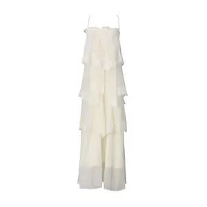 Detailed view of white tiered camisole maxi dress with elegant lace trim details