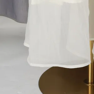 Detailed view showing the sheer white lace hemline of this sweet style layered cake dress