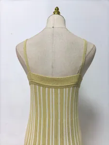Detailed macro view of yellow and white vertical striped knit camisole dress back area