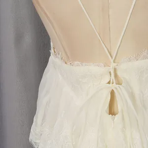 Close-up view of the elegant white lace-up back detail on a sweet style chiffon dress