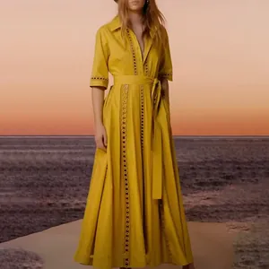 Detailed view of yellow French vintage maxi dress with hollow-out lace and waist tie