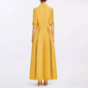 Back view of a yellow French vintage court style dress with hollow-out lace details