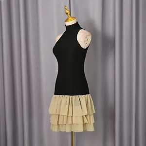 Side view of elegant contrast sleeveless dress with tiered ruffled tutu skirt and stand collar