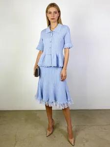 Elegant French style light blue knitted two-piece set with polo top and lace hem A-line skirt
