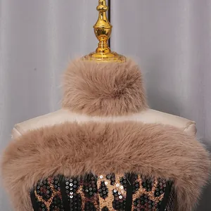 Detailed view of fashionable leopard print sequin corset and fluffy faux fur accessories