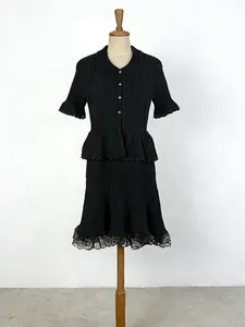 French style black knitted two-piece set with polo neck top and high waist A-line skirt