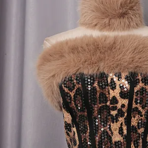 Detailed macro view of sexy leopard print top featuring sequins and brown faux fur trim