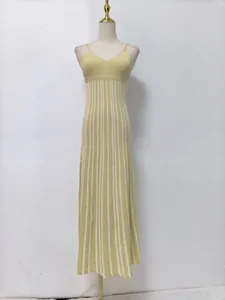 Yellow and white striped sleeveless camisole maxi dress with high-waisted design.