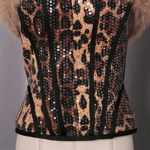 Macro detail shot of a sexy leopard print sequin corset with luxurious fur trim