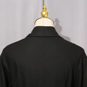 Detail of the back collar and shoulder of a black French retro palace style dress