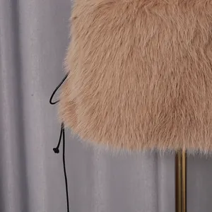 Macro view of camel faux fur texture on a stylish tube top with side lacing details.
