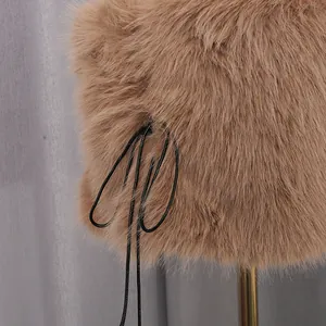 Close-up detail of luxury brown faux fur tube top featuring elegant black drawstring lace-up